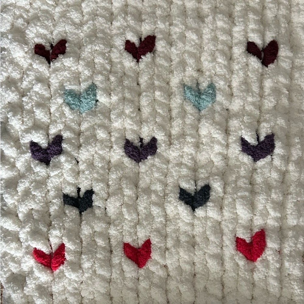 Handmade chunky knit Cream coloured pet bed with multi coloured hearts
